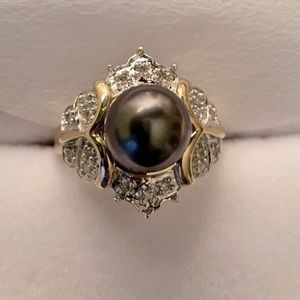 Tahitian Pearl 8.8 mm, 14K gold band with diamond accents.